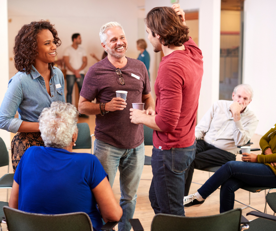 Group of adults talking in a casual meeting.